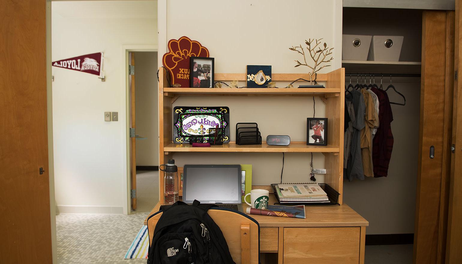 视图 of desk space and hallway in dorm